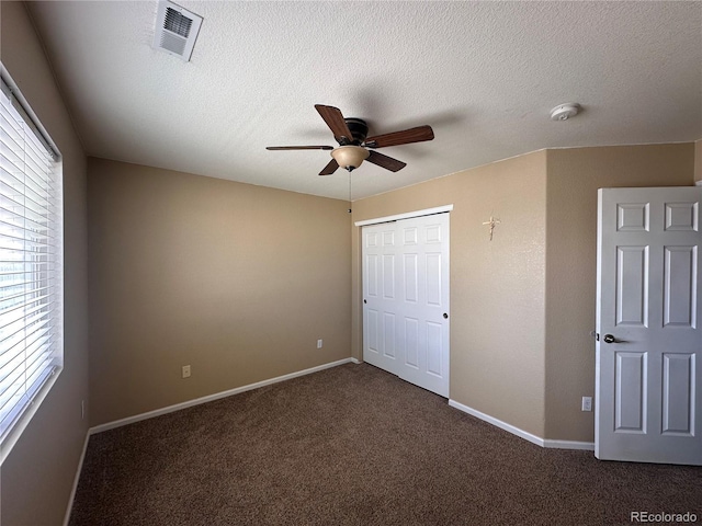 9616 Nucla St, Commerce City, CO 80022 - unfurnished bedroom featuring carpet floors, a closet, baseboards, a ceiling fan, and a textured ceiling