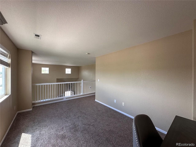 9616 Nucla St, Commerce City, CO 80022 - carpeted empty room with baseboards and a textured ceiling