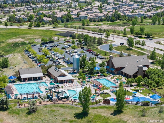 birds eye view of property with a residential view