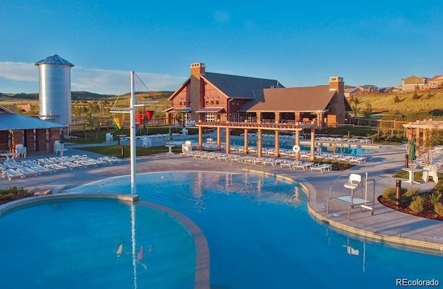 view of pool featuring a pool with connected hot tub