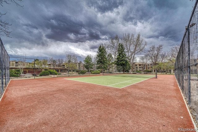 view of sport court featuring fence