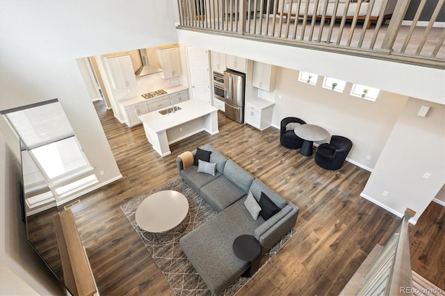10557 Eby Cir, Lone Tree, CO 80124 - living area featuring a high ceiling and dark wood-style flooring