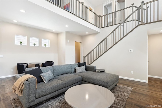 10557 Eby Cir, Lone Tree, CO 80124 - living area featuring wood finished floors, stairway, recessed lighting, and a high ceiling