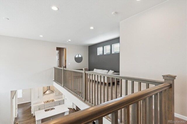10557 Eby Cir, Lone Tree, CO 80124 - hallway with recessed lighting, an upstairs landing, and wood finished floors
