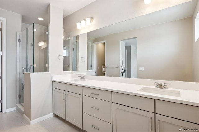 10557 Eby Cir, Lone Tree, CO 80124 - bathroom with double vanity, a shower stall, and tile patterned floors