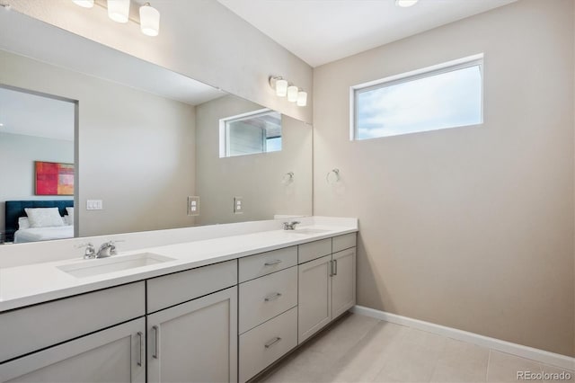 10557 Eby Cir, Lone Tree, CO 80124 - ensuite bathroom with double vanity and tile patterned flooring