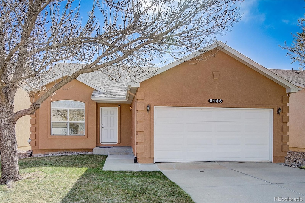 ranch-style home with a garage