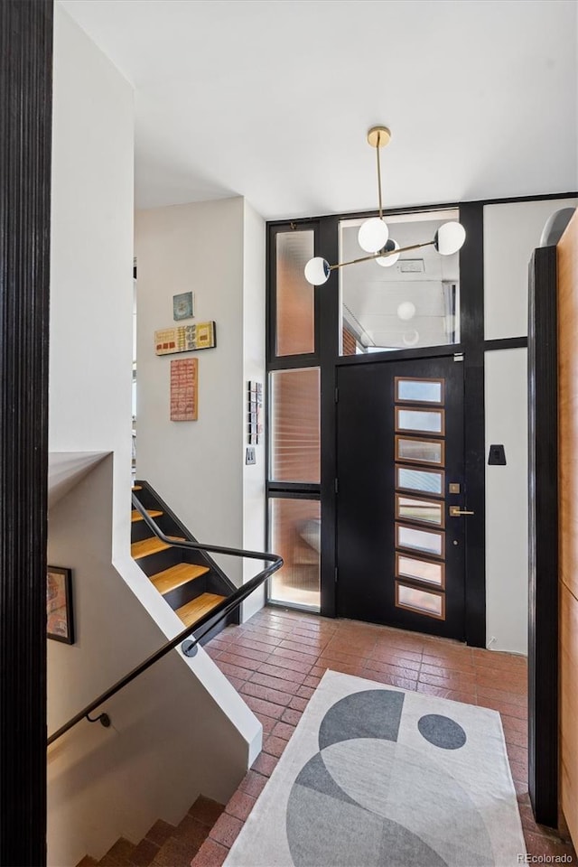 3895 Chimayo Rd, Littleton, CO 80123 - tiled entrance foyer with stairway