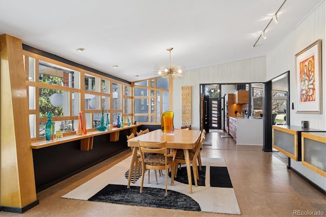 3895 Chimayo Rd, Littleton, CO 80123 - dining room featuring track lighting, tile patterned floors, and a chandelier
