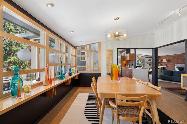 3895 Chimayo Rd, Littleton, CO 80123 - dining area featuring a chandelier and rail lighting
