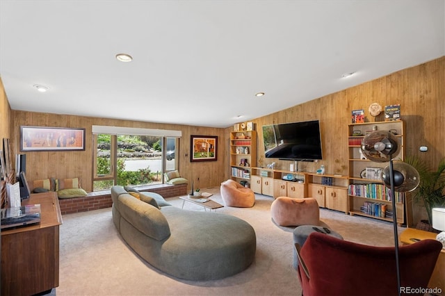 3895 Chimayo Rd, Littleton, CO 80123 - living room featuring carpet flooring, wooden walls, and built in shelves