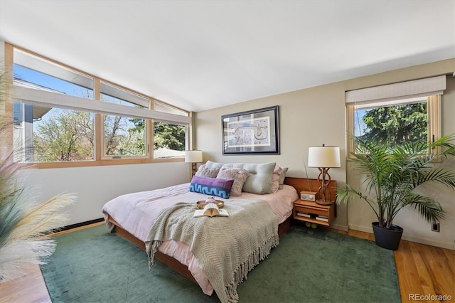 3895 Chimayo Rd, Littleton, CO 80123 - bedroom with baseboards, vaulted ceiling, and wood finished floors