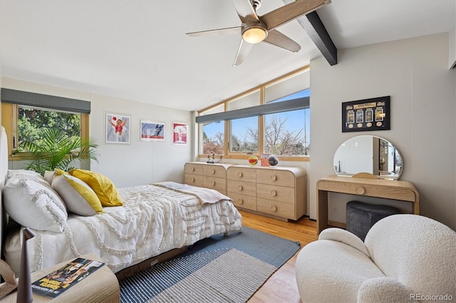 3895 Chimayo Rd, Littleton, CO 80123 - bedroom with light wood-style flooring, lofted ceiling with beams, and a ceiling fan