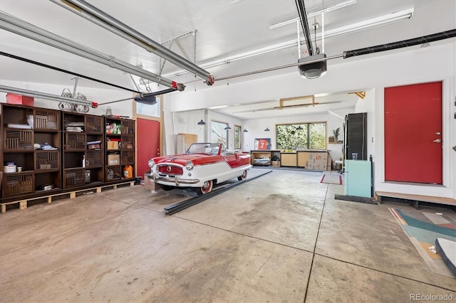 3895 Chimayo Rd, Littleton, CO 80123 - garage featuring a garage door opener