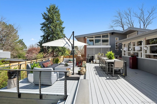 3895 Chimayo Rd, Littleton, CO 80123 - wooden terrace with outdoor dining space and an outdoor living space