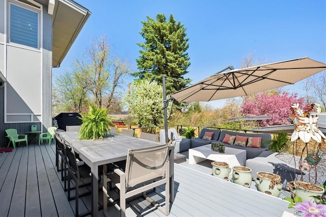 3895 Chimayo Rd, Littleton, CO 80123 - wooden deck featuring an outdoor living space with a fire pit and outdoor dining space