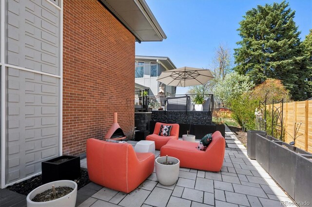3895 Chimayo Rd, Littleton, CO 80123 - view of patio with outdoor lounge area and fence