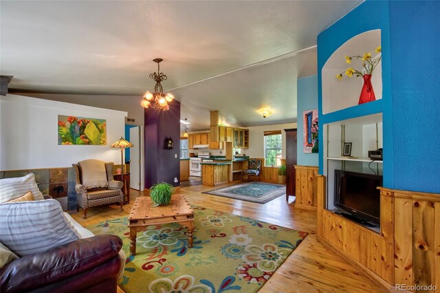 166 Ski Doo Rd, Fairplay, CO 80440 - living area with light wood finished floors, a chandelier, and vaulted ceiling