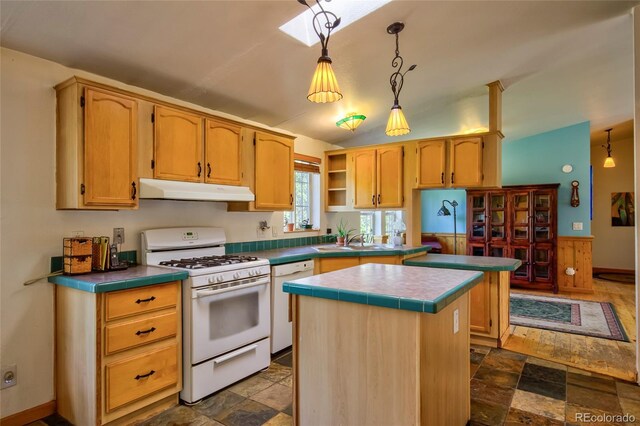 166 Ski Doo Rd, Fairplay, CO 80440 - kitchen with white appliances, under cabinet range hood, stone finish floors, a center island, and a sink
