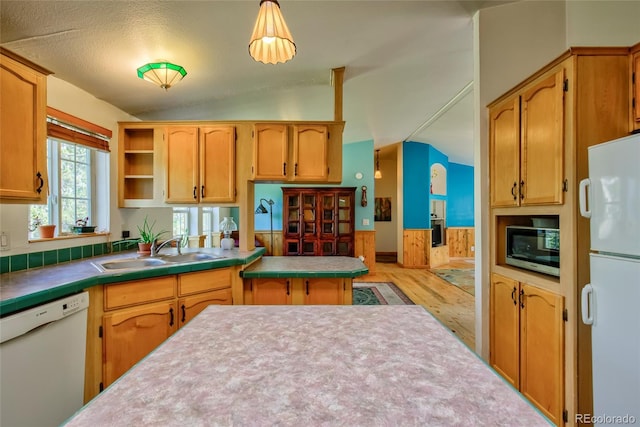 166 Ski Doo Rd, Fairplay, CO 80440 - kitchen featuring white appliances, a sink, vaulted ceiling, light wood-style flooring, and tile countertops