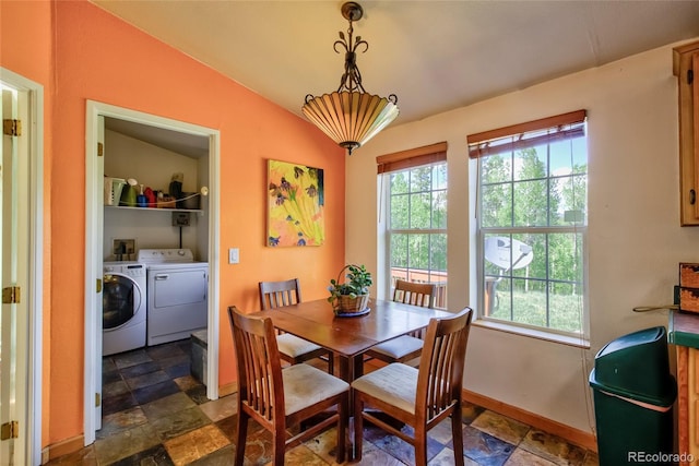 166 Ski Doo Rd, Fairplay, CO 80440 - dining room featuring washer and dryer, stone tile flooring, baseboards, and lofted ceiling