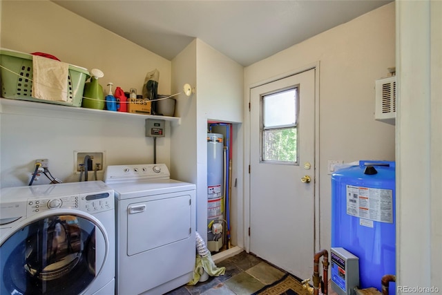 166 Ski Doo Rd, Fairplay, CO 80440 - laundry room with water heater, washing machine and clothes dryer, and stone finish floors