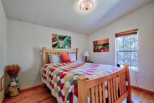 166 Ski Doo Rd, Fairplay, CO 80440 - bedroom with lofted ceiling, baseboards, and hardwood / wood-style floors