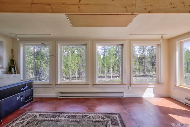 166 Ski Doo Rd, Fairplay, CO 80440 - unfurnished sunroom featuring a baseboard radiator and rail lighting