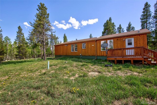 166 Ski Doo Rd, Fairplay, CO 80440 - back of property with a wooden deck and a lawn