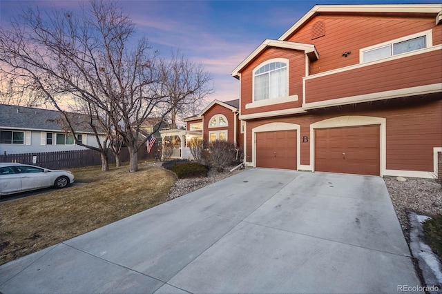 exterior space featuring a garage and a yard