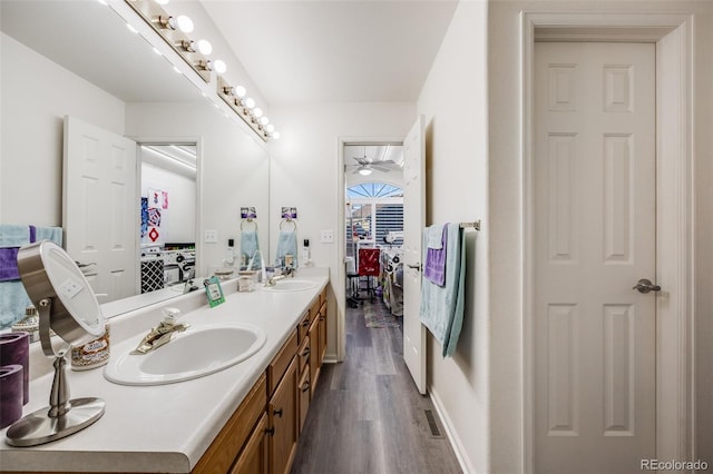 bathroom with vanity, hardwood / wood-style flooring, and ceiling fan