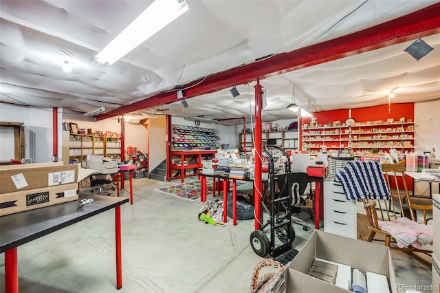 interior space featuring concrete flooring and a workshop area