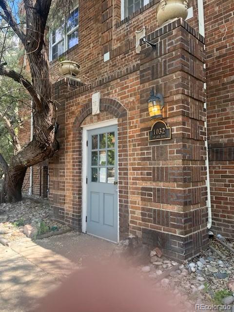 1024 E 14th Ave Unit 2, Denver, CO 80218 - doorway to property with brick siding