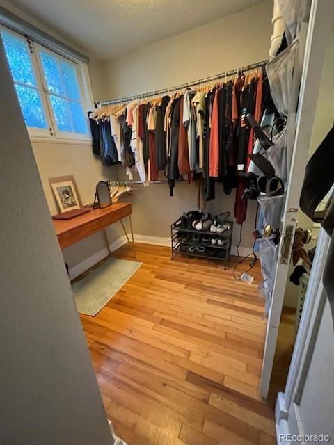 1024 E 14th Ave Unit 2, Denver, CO 80218 - walk in closet with hardwood / wood-style flooring