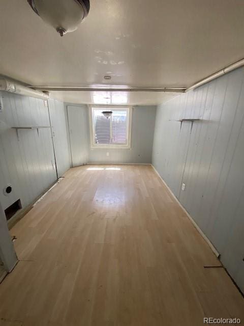 basement featuring light wood-type flooring