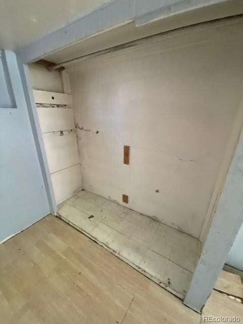 below grade area featuring wood finished floors