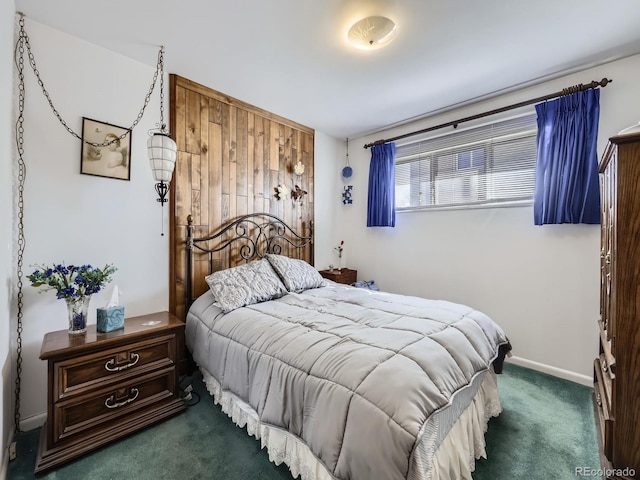 carpeted bedroom with baseboards