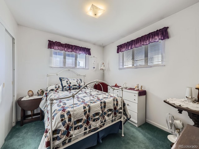 carpeted bedroom with baseboards