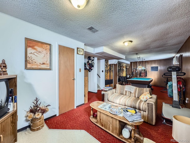 living area with stairway, visible vents, a textured ceiling, and pool table