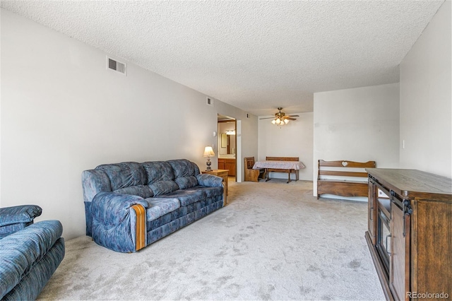 3550 S Harlan St Unit 214, Denver, CO 80235 - living area with carpet floors, a textured ceiling, and ceiling fan