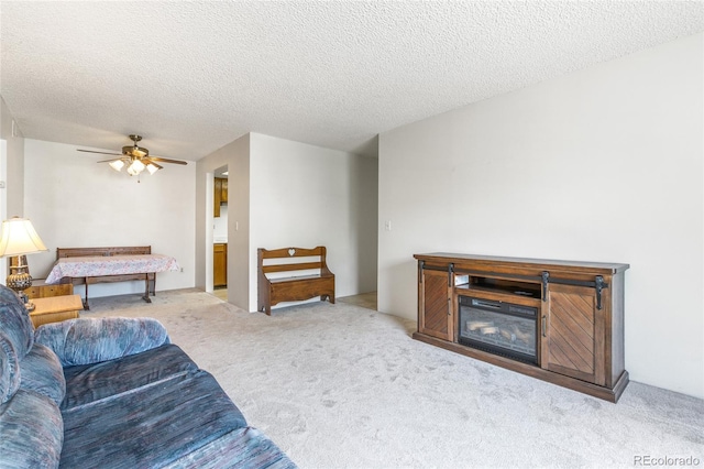3550 S Harlan St Unit 214, Denver, CO 80235 - living room with carpet flooring, ceiling fan, and a textured ceiling
