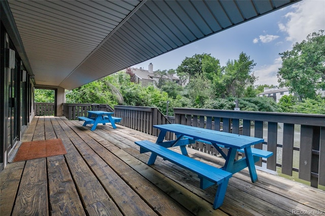 3550 S Harlan St Unit 214, Denver, CO 80235 - wooden terrace with outdoor dining area
