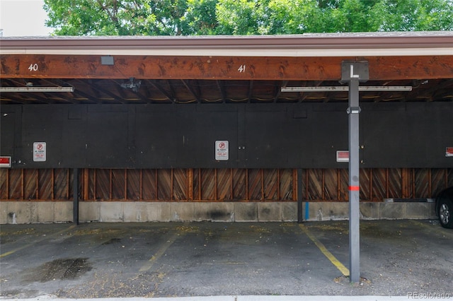 3550 S Harlan St Unit 214, Denver, CO 80235 - garage featuring covered parking
