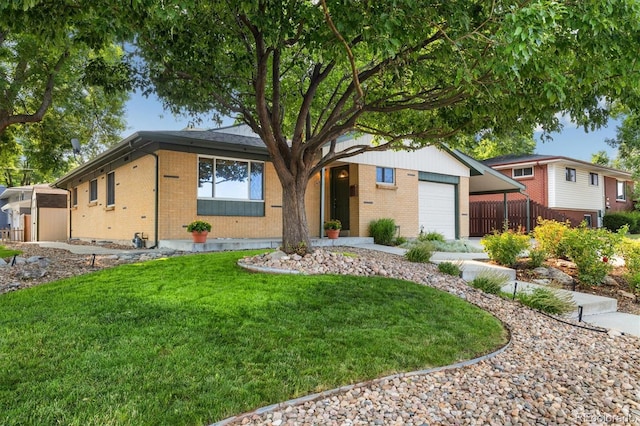 6290 Quail St, Arvada, CO 80004 - ranch-style house featuring brick siding, an attached garage, and a front lawn