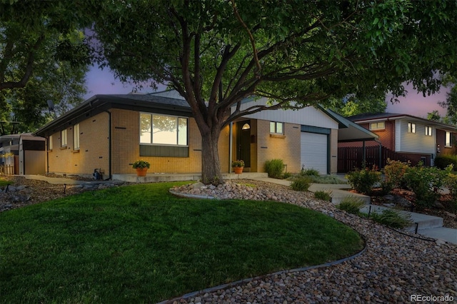 6290 Quail St, Arvada, CO 80004 - ranch-style home featuring brick siding, an attached garage, and a front yard