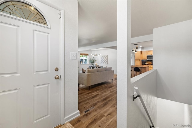 6290 Quail St, Arvada, CO 80004 - entryway featuring wood finished floors and baseboards
