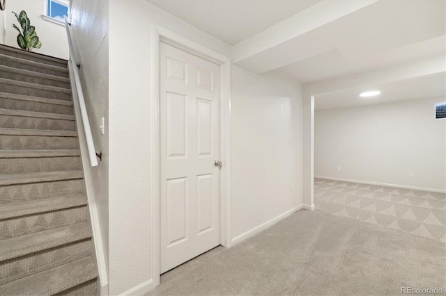 6290 Quail St, Arvada, CO 80004 - finished below grade area with light colored carpet and stairway