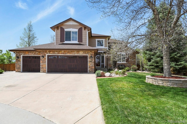 9536 W Avalon Dr, Littleton, CO 80127 - view of front of home with driveway, stone siding, a garage, and a shingled roof