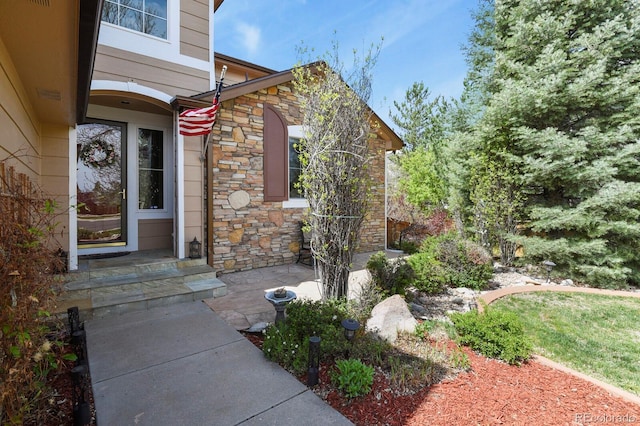 9536 W Avalon Dr, Littleton, CO 80127 - view of exterior entry featuring stone siding