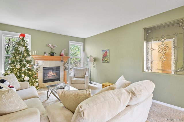 9536 W Avalon Dr, Littleton, CO 80127 - carpeted living area with a tiled fireplace and baseboards